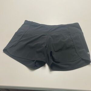 Size 6 black lululemon speed up shorts 4”